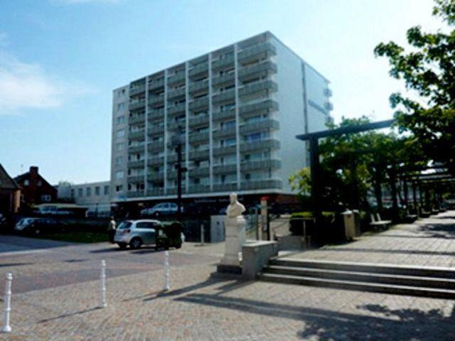 a building with a fire hydrant in front of a building at Sylter-Mitte in Westerland (Sylt)