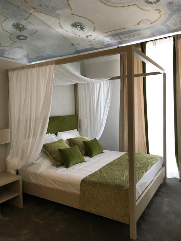 Postel nebo postele na pokoji v ubytování Palazzo Franceschini