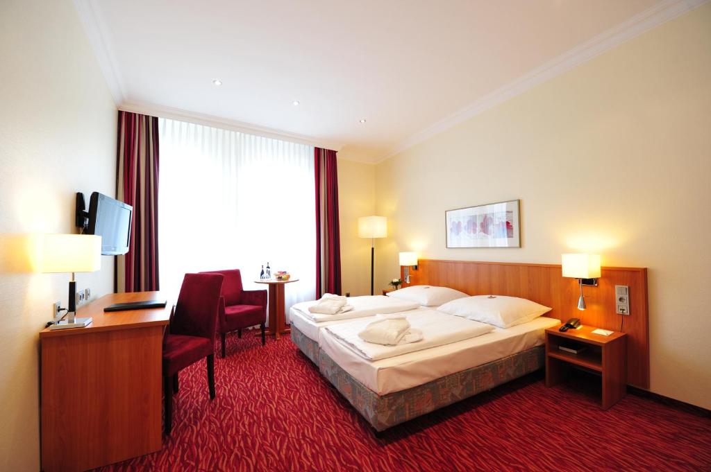 Postel nebo postele na pokoji v ubytování Frühlings-Hotel