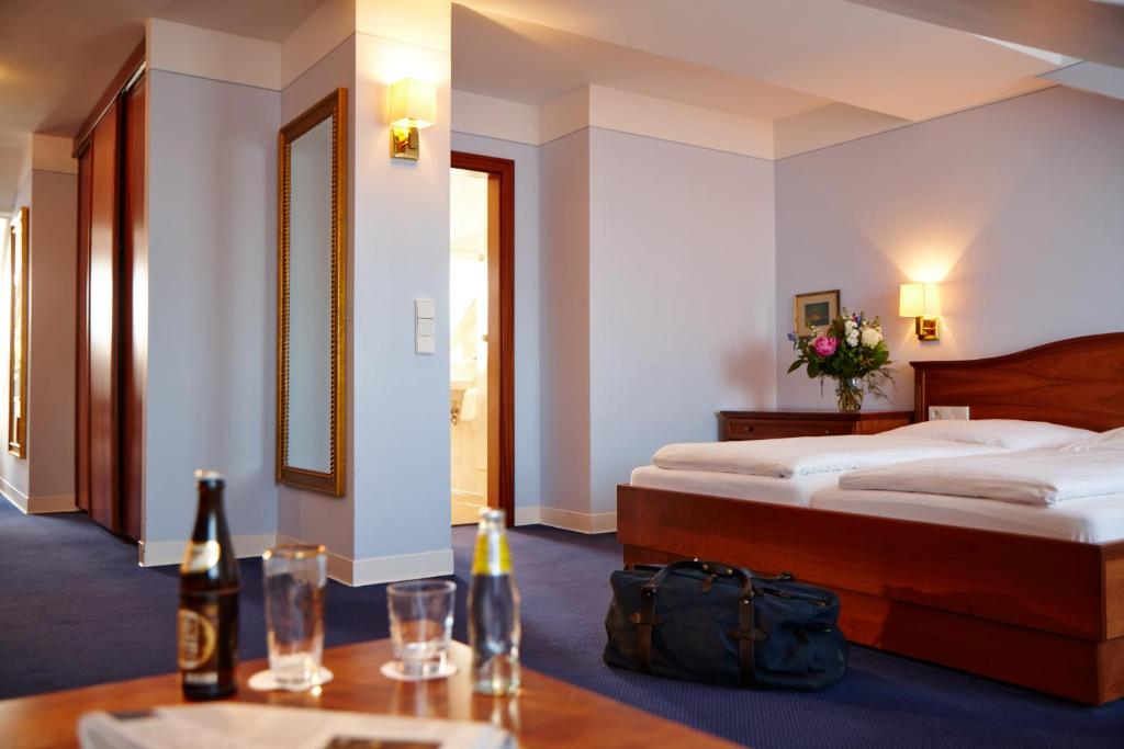 Postel nebo postele na pokoji v ubytování Hotel Concorde