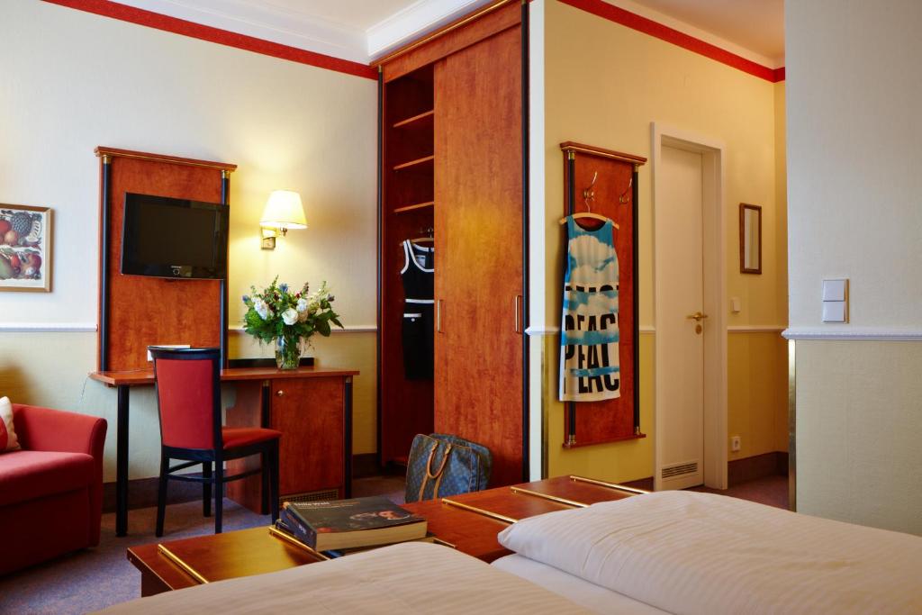 Postel nebo postele na pokoji v ubytování Hotel Concorde