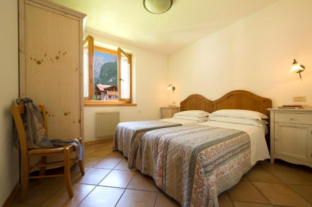 Postel nebo postele na pokoji v ubytování Residence Rio Piccolo