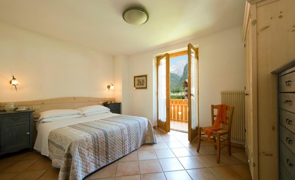 Postel nebo postele na pokoji v ubytování Residence Rio Piccolo