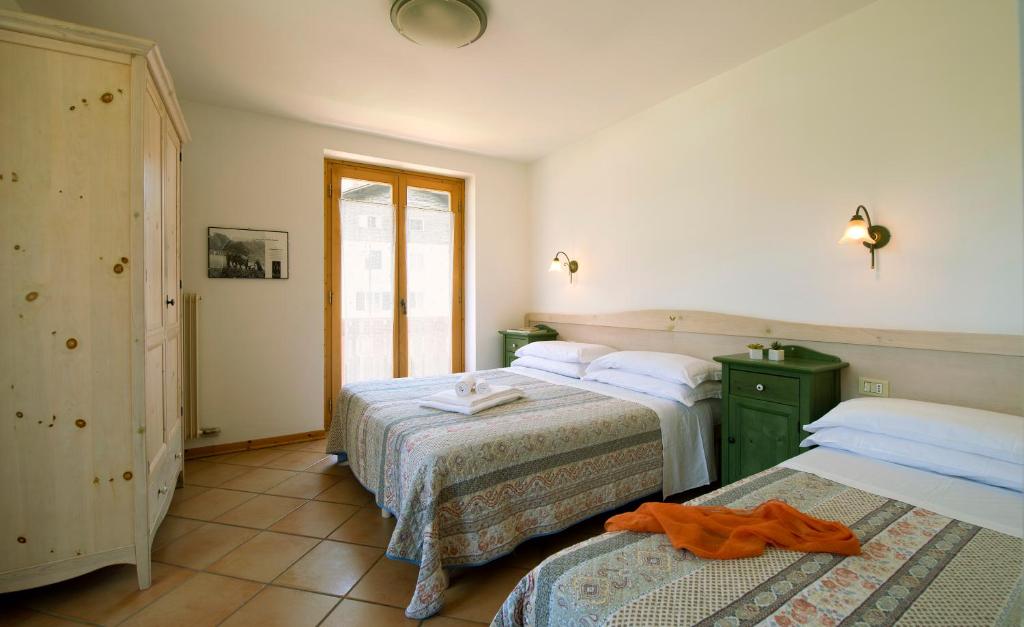 Postel nebo postele na pokoji v ubytování Residence Rio Piccolo