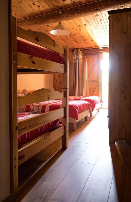Postel nebo postele na pokoji v ubytování La Roche du Croue