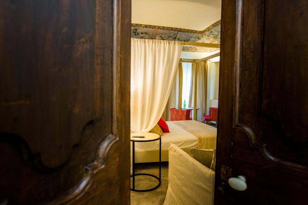 Postel nebo postele na pokoji v ubytování Palazzo Franceschini