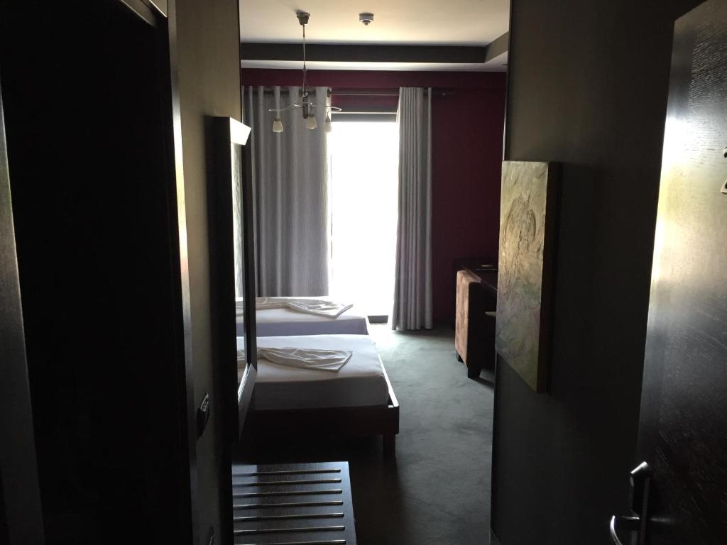 Postel nebo postele na pokoji v ubytování Icon Hotel