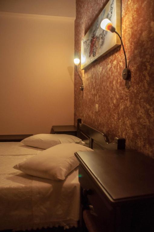 Łóżko lub łóżka w pokoju w obiekcie Christofer's Rooms