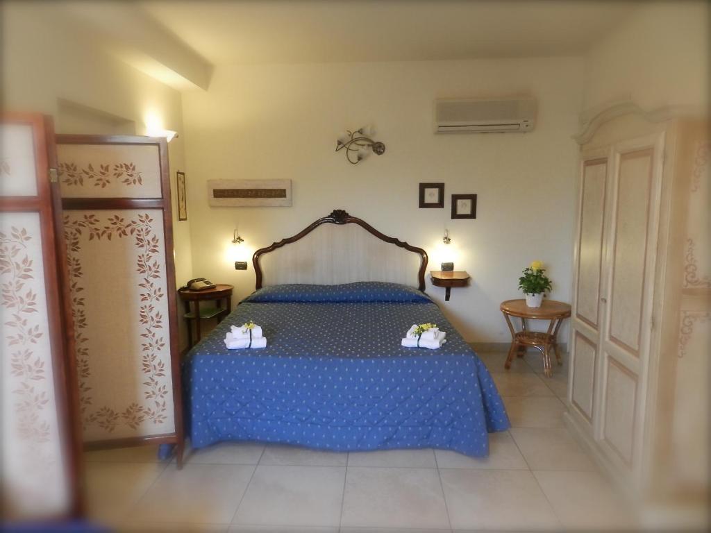 Postel nebo postele na pokoji v ubytování Hotel Ristorante Piccolo Chianti