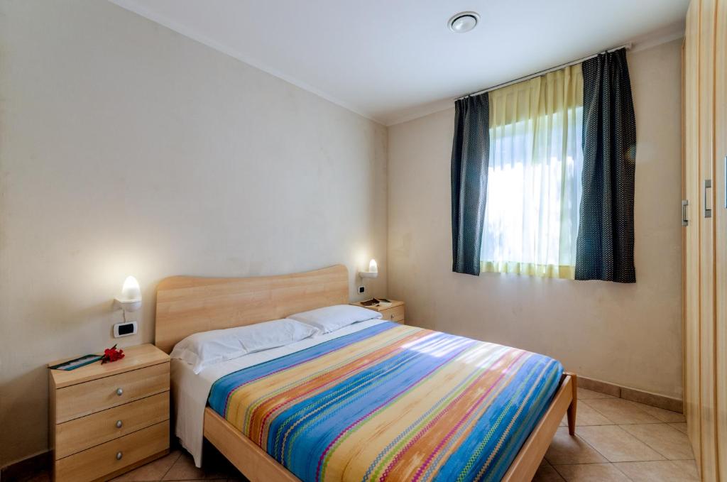 Postel nebo postele na pokoji v ubytování Camping Village Du Parc