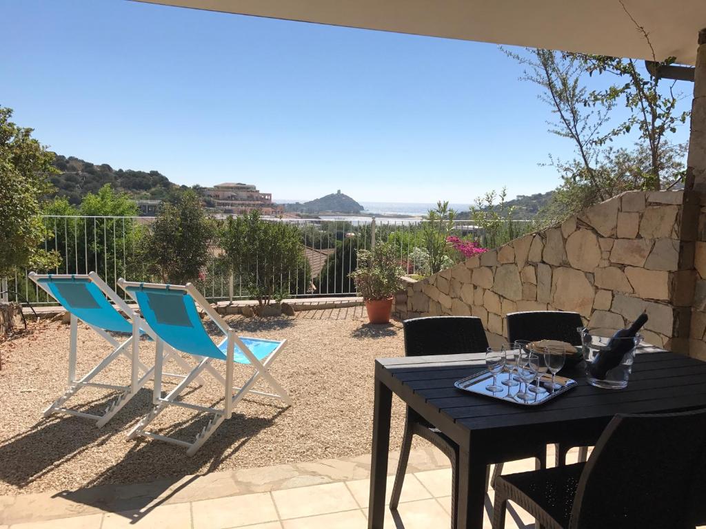 a table and chairs sitting on a patio at Sa Tirìa in Chia