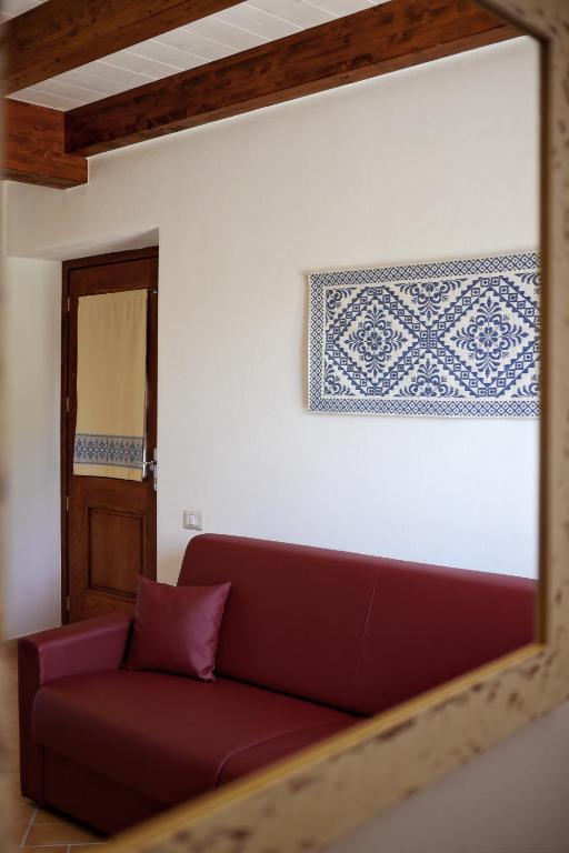 Een zitgedeelte bij Agriturismo Casale Degli Ulivi Alghero