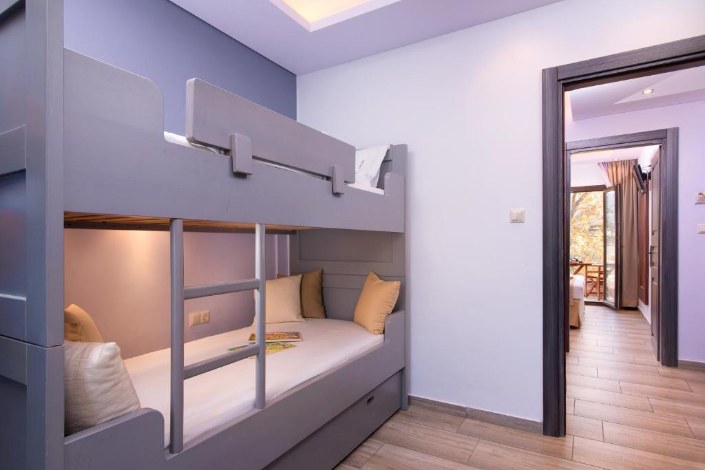 A bed or beds in a room at Studios Apartments Irini Patira