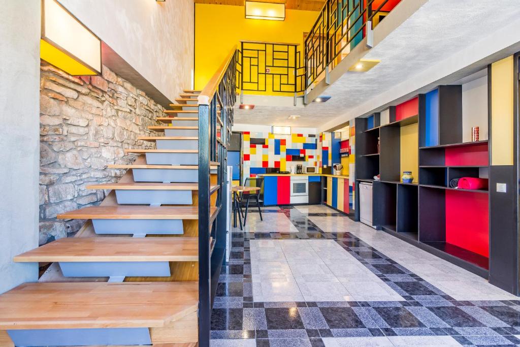 a staircase in a room with colorful walls and floors at House Mondrian in Vodnjan