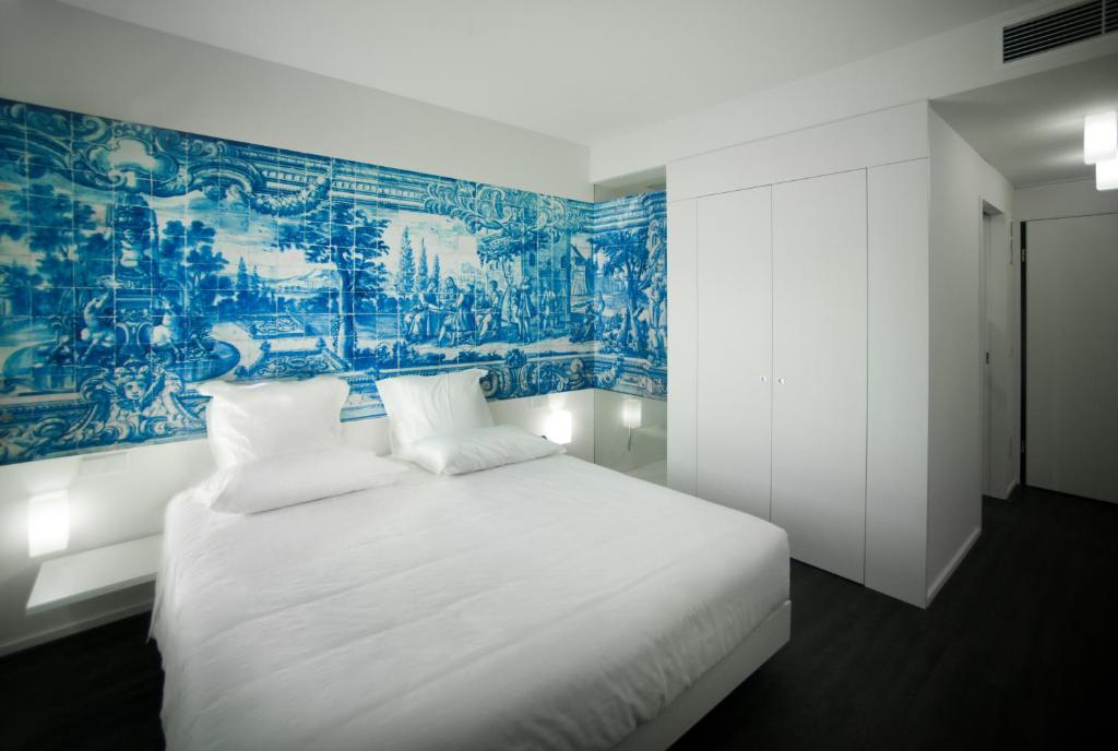 Postel nebo postele na pokoji v ubytování Design & Wine Hotel