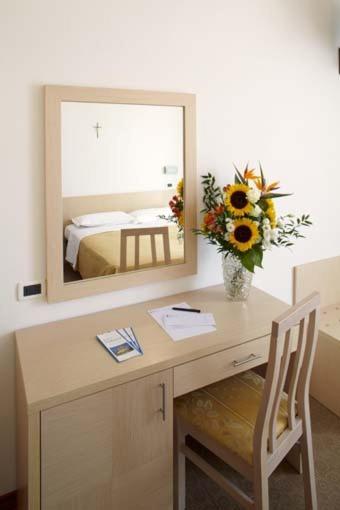 Postel nebo postele na pokoji v ubytování Hotel Dolores