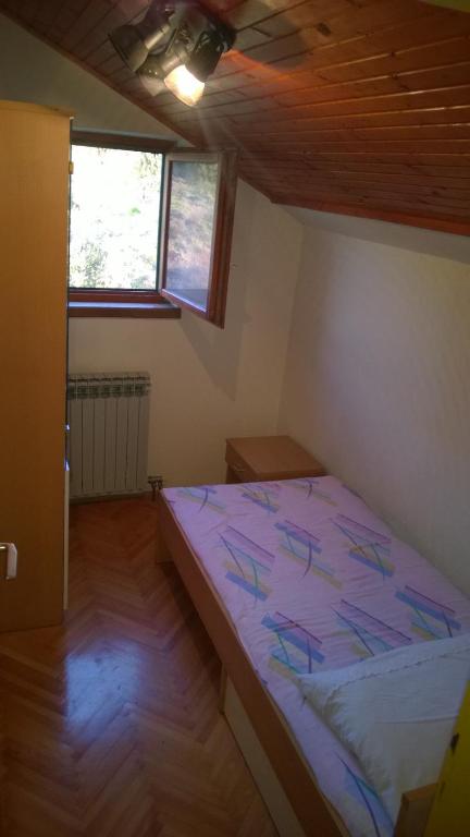 Postel nebo postele na pokoji v ubytování Svetin Apartments