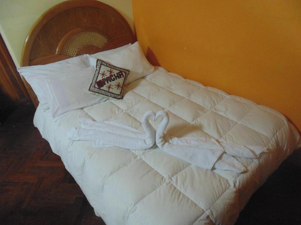 Postel nebo postele na pokoji v ubytování Pacha Suite