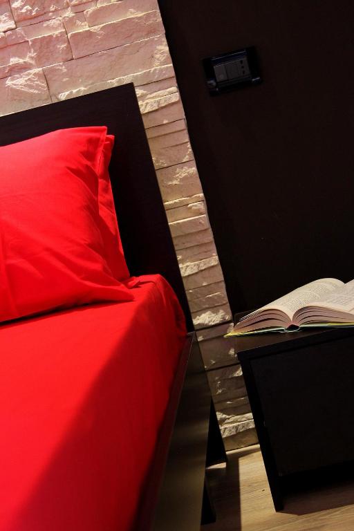 Postel nebo postele na pokoji v ubytování B&B La Bouganville