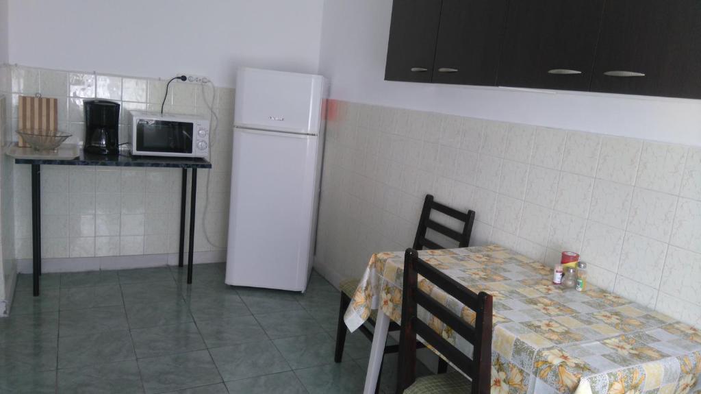 Kuchyň nebo kuchyňský kout v ubytování Zoi Residence