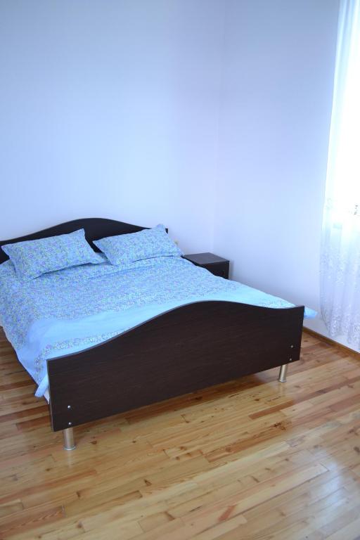 Postel nebo postele na pokoji v ubytování Shalva Apartment