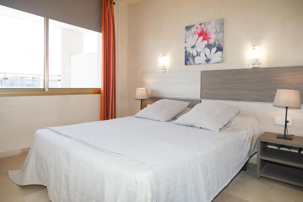 Posteľ alebo postele v izbe v ubytovaní UHC Michelangelo Apartments