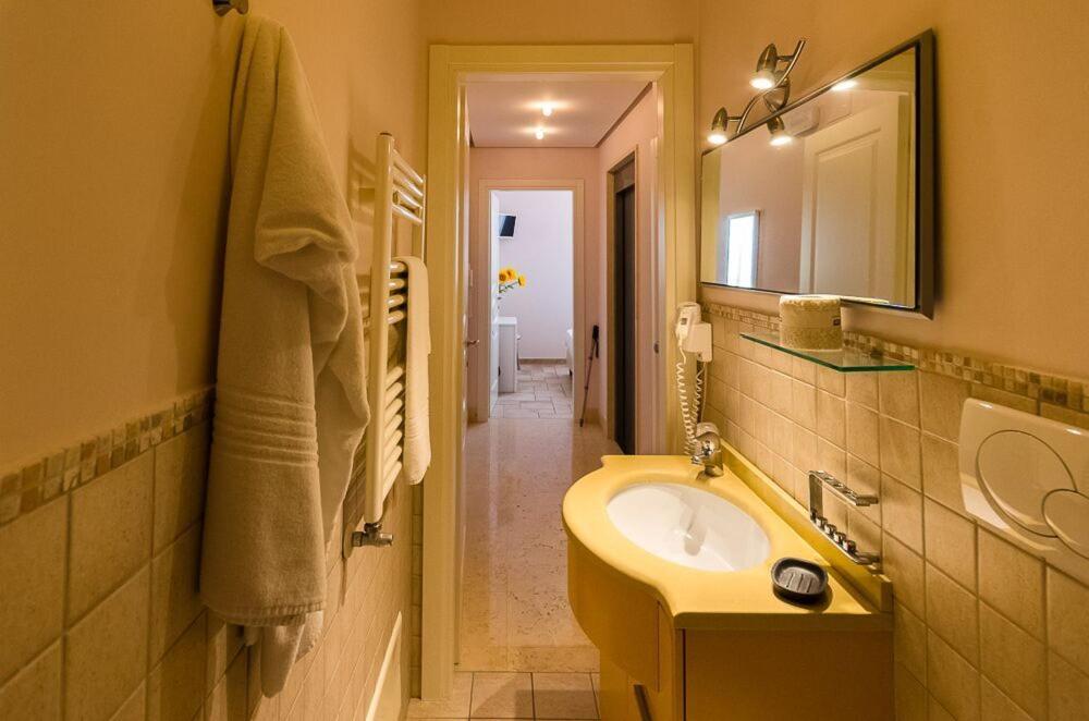 a bathroom with a sink and a mirror at Sogno D'Epoca 1822 in Monopoli