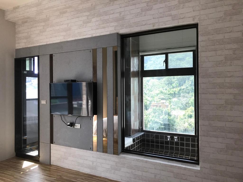 TV a/nebo společenská místnost v ubytování Ruo Shui Hotspring Hotel
