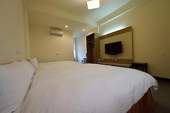 Postel nebo postele na pokoji v ubytování Shan Jhong You You B&B