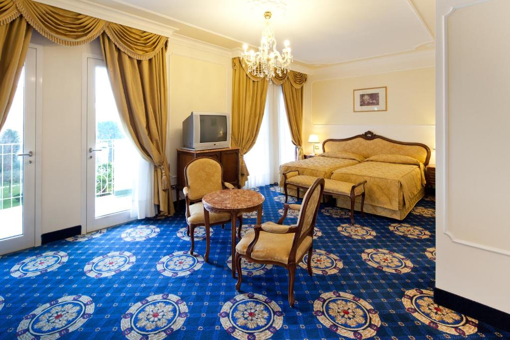 Postel nebo postele na pokoji v ubytování Hotel La Residence & Idrokinesis