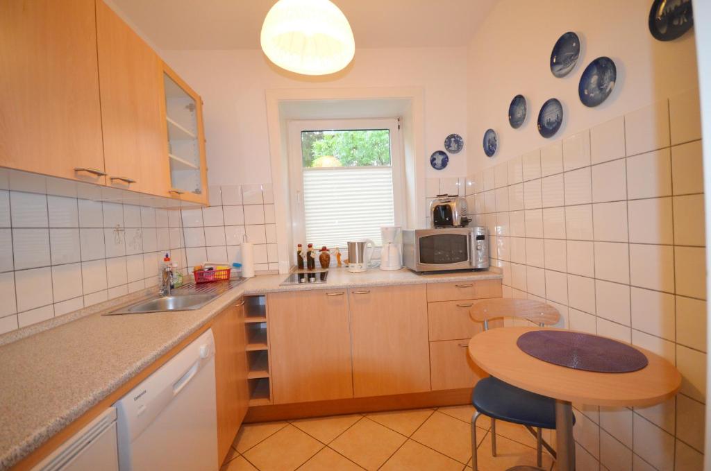 Kuchyň nebo kuchyňský kout v ubytování Ostseehaus Dreesen