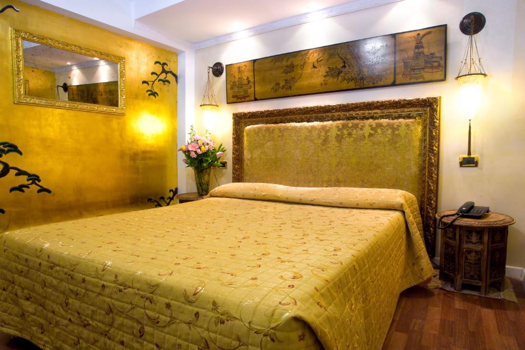 Postel nebo postele na pokoji v ubytování Hotel Noemi