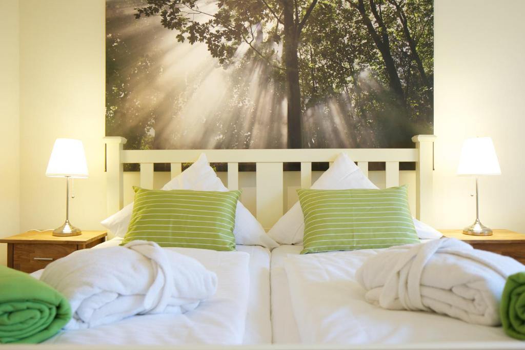 Postel nebo postele na pokoji v ubytování Das Frühstückshotel Sankt Peter-Ording