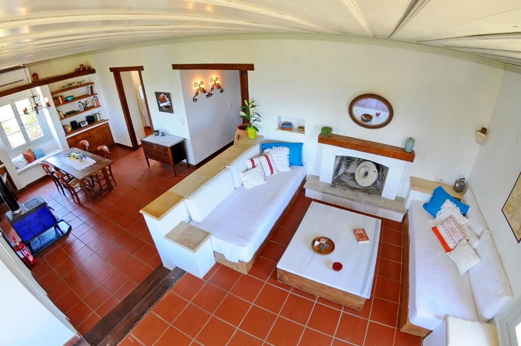 an overhead view of a living room with white furniture at Domus Nostos in Apolpaina