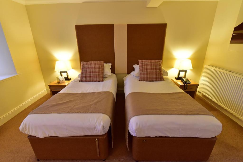 Postel nebo postele na pokoji v ubytování Moness Resort