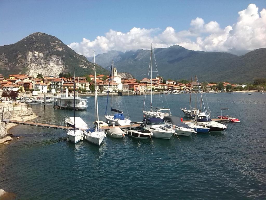 a bunch of boats are docked in a harbor at Casa Mailinne in Baveno