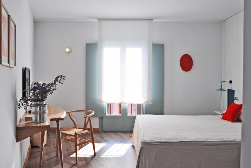 Postel nebo postele na pokoji v ubytování Hotel Ayllon