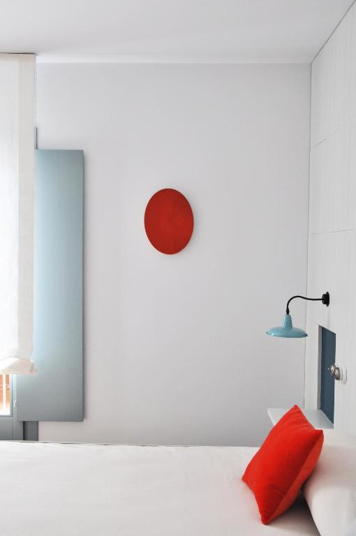 Postel nebo postele na pokoji v ubytování Hotel Ayllon