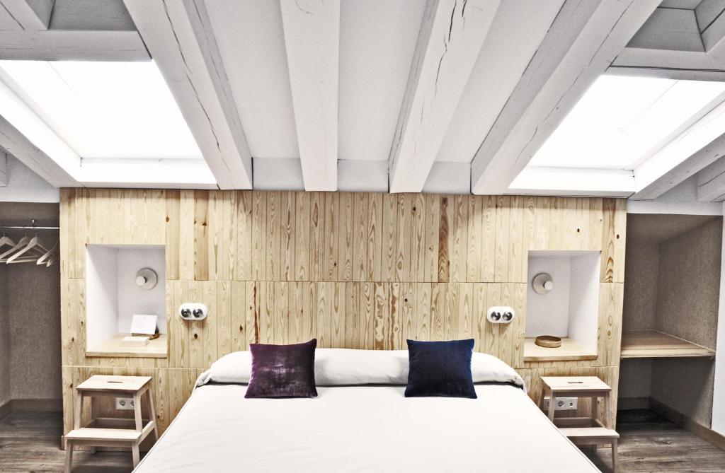 Postel nebo postele na pokoji v ubytování Hotel Ayllon