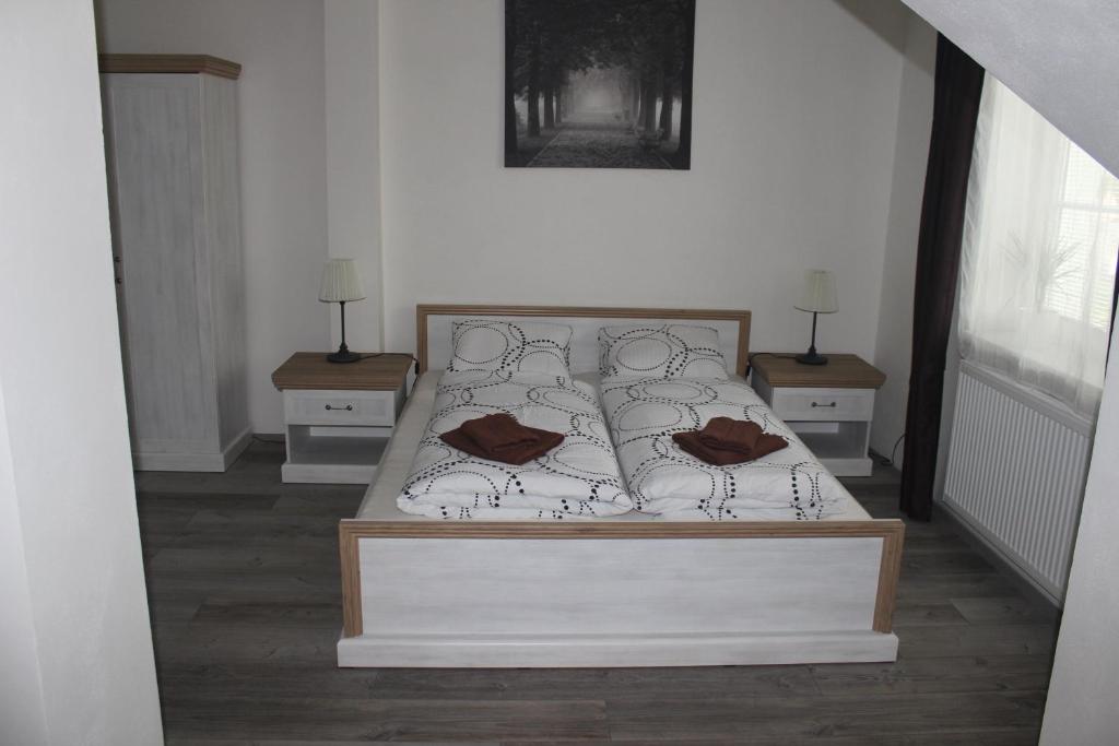 Rúm í herbergi á Penzion Vesely