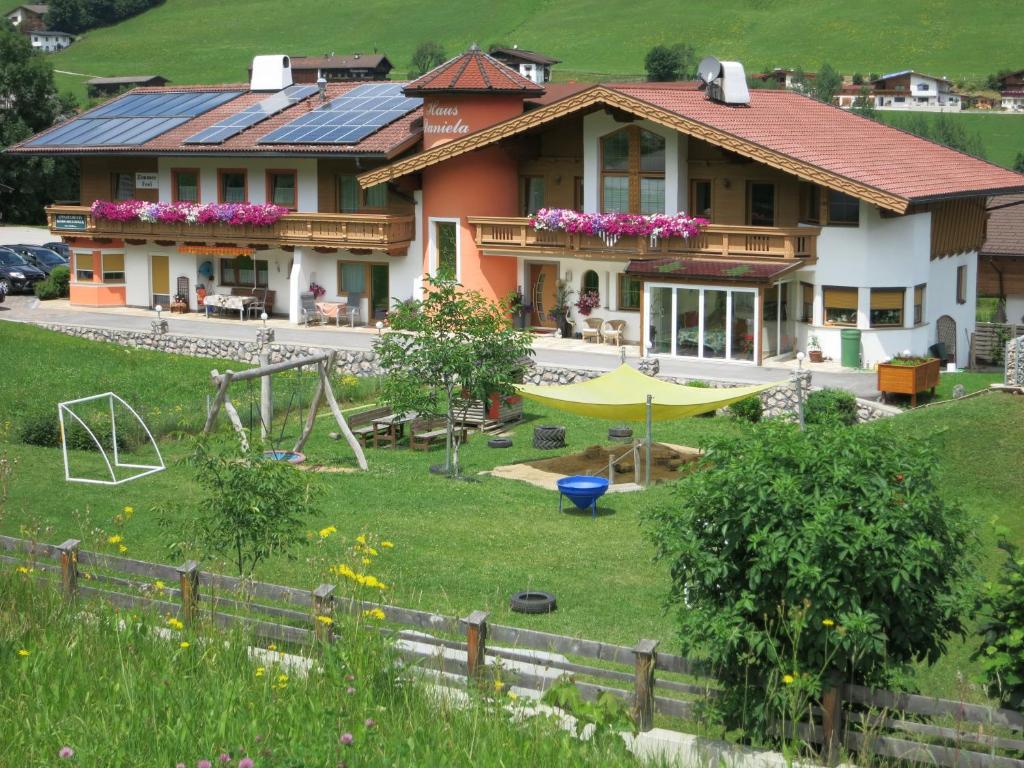 a house with a playground in front of it at Haus Daniela in Wildschönau
