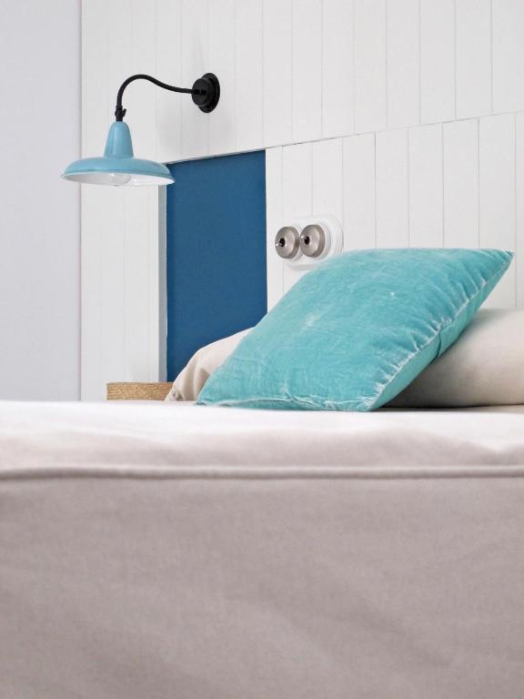 Postel nebo postele na pokoji v ubytování Hotel Ayllon