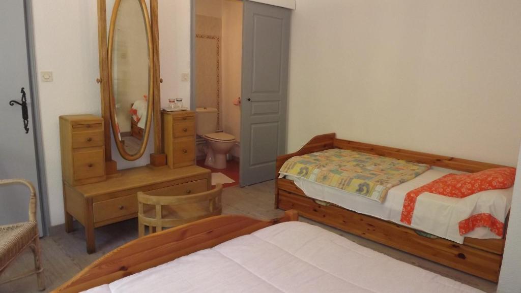 Postel nebo postele na pokoji v ubytování La Bastide