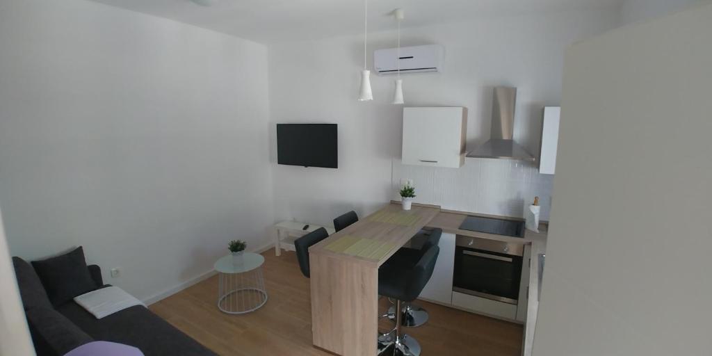 Телевизор и/или развлекательный центр в APARTMAN ERCEGOVIĆ