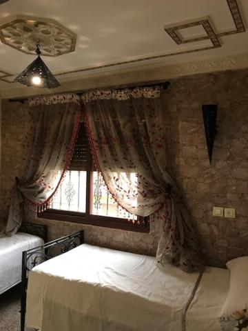 Postel nebo postele na pokoji v ubytování Riad Dar Mesouda