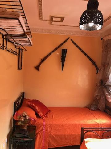 Postel nebo postele na pokoji v ubytování Riad Dar Mesouda