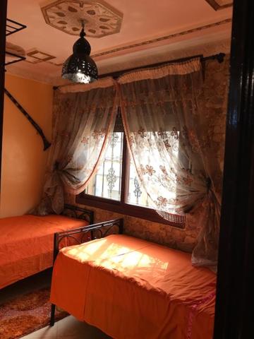 Postel nebo postele na pokoji v ubytování Riad Dar Mesouda