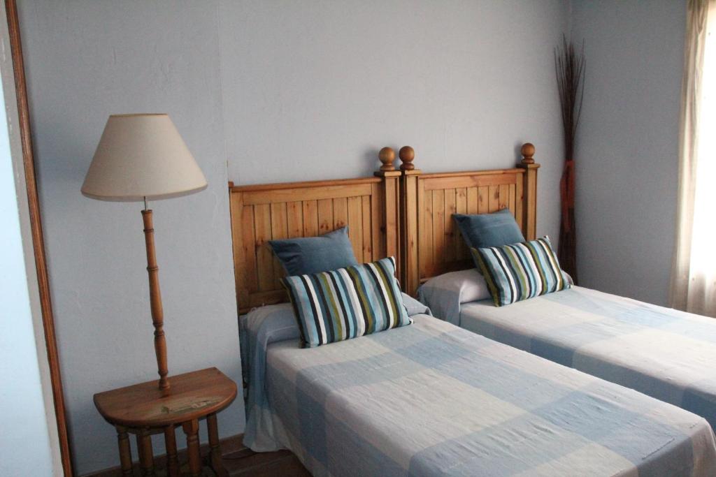 A bed or beds in a room at Casa Rural Celtia