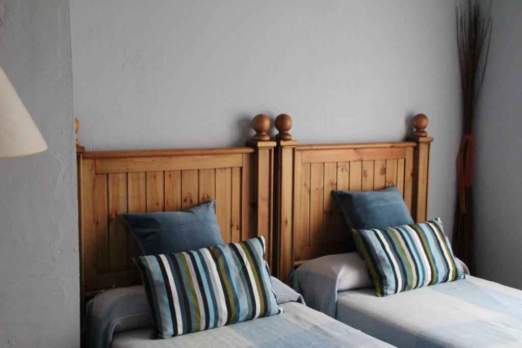 A bed or beds in a room at Casa Rural Celtia