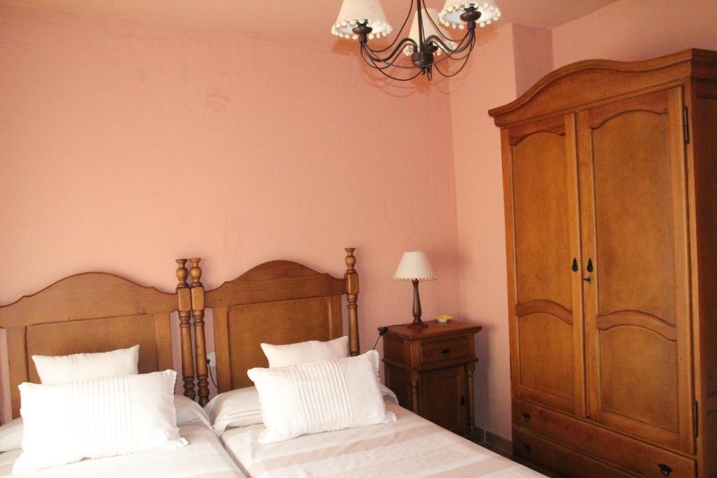 A bed or beds in a room at Casa Rural Celtia
